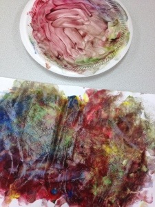 Cooter painted his paper and then continued to paint the plate his paints had been on.  His hands were covered.  It took a little while and a bit of scrubbing to get them clean again.  
