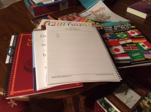 Getting all of our books together for tomorrow.