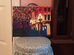 My painting from across he room.  I can handle y'all seeing this.  It's not perfect, but I rather like it.  "Tardis in the Rain" our teacher called it. 
